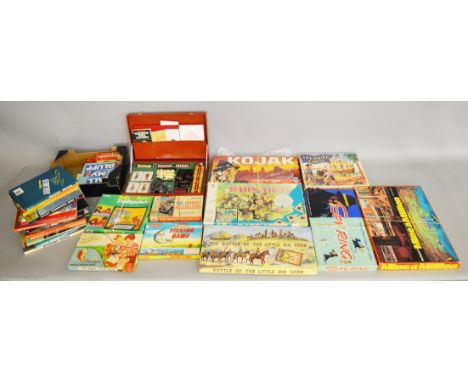 A quantity of boxed vintage games and puzzles by Waddington's, Merit and others including 'Kojak Detective Game', 'The Beverl