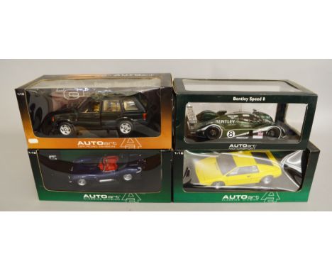 Four AutoArt 1:18 scale diecast model cars: Range Rover 4.6 HSE; Jaguar XK SS; Bentley Speed 8; Lotus Esprit. Boxed, G-VG. (4