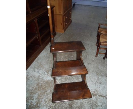 Set of mahogany wide stepped library steps with turned column hand post and three steps with pierced detail to the sides (59c