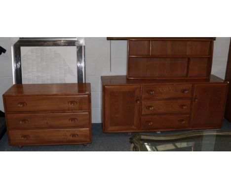 A 1960/70 Ercol Elm Windsor Sideboard, with three central drawers flanked by cupboard doors, on castors, 155cm by 43cm by 69c