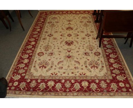 Afghan Ziegler design carpet, modern, the ivory field of vines enclosed by blood red meandering vine borders, 270cm by 188cm.