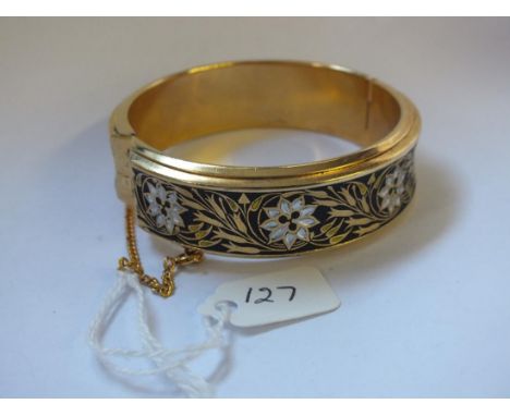 An enamelled hinged bangle with flower decoration  