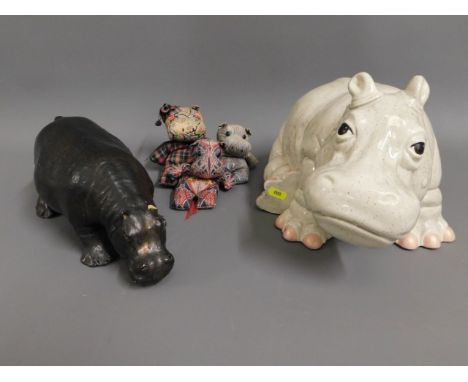 Two ceramic models of hippo's, one with faults, twinned with three Liberty of London hippo bean bag 