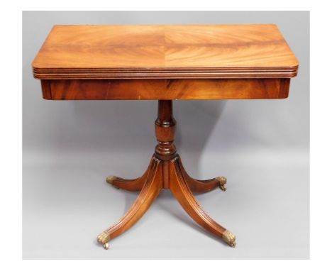 A Regency style mahogany card table with brass claw feet, baize faded, 29.5in high x 33.375in square