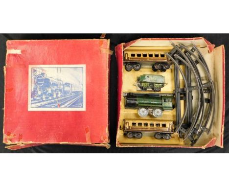 An English tin plate clockwork train set, one carriage loss to one wheel, engine winds &amp; runs, box a/f