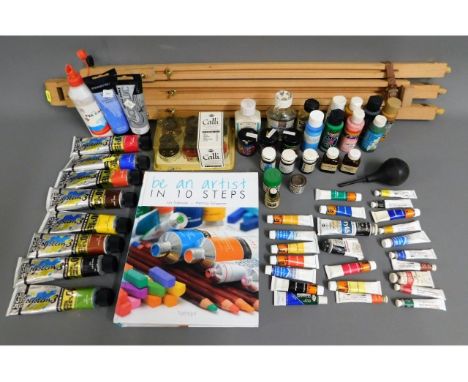A quantity of artist paints &amp; materials with easel
