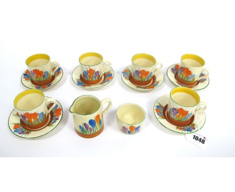 A Newport Pottery Clarice Cliff Part Coffee Service, painted in the Crocus pattern against a cream ground with brown bands, p