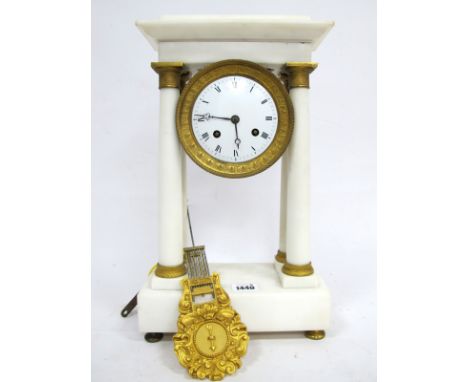 A Late XIX Century White Marble and Ormolu Portico Mantle Clock, with four tapered pillars and rectangular base raised on bun