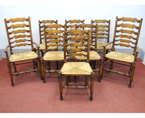 A Set of Eight XX Century Ash Ladder Back Dining Chairs, (two carver and eight single) with rush seats, on turned legs united