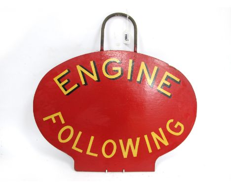 Railwayana; An Oval 'Engine Following' Sign, in red with metal handle, 39 x 53cm.