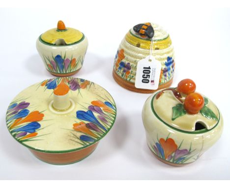 A Wilkinson Ltd Pottery Clarice Cliff Honey Pot and Cover, with bee finial, the ribbed body painted in the Crocus pattern aga