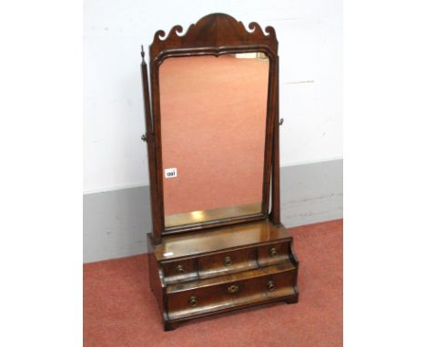 An Early XVIII Century Walnut Dressing Table Mirror, with arched and scroll decoration, tapering supports, four shaped drawer