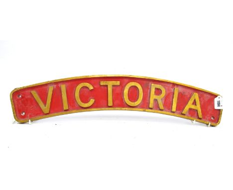 Railwayana; An Engine Plaque 'Victoria', painted red with gilt lettering and border, of curved form, 71cm long. Lot 1194 - Or