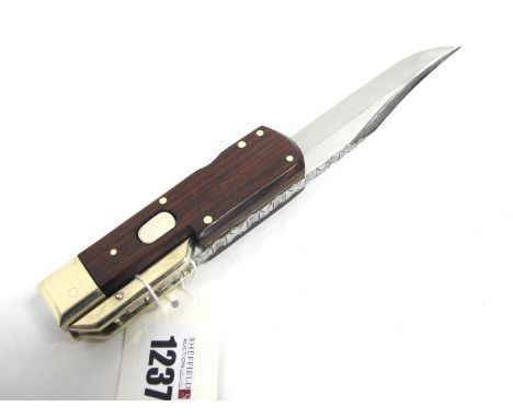 Stan Shaw; A Folding Bowie Knife, with wooden scales, brass bolster and cross guard, workback length of spine and blade, push