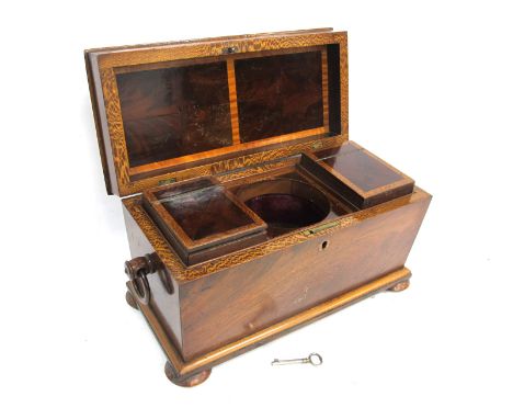 A Mid XIX Century Mahogany Tea Caddy, of sarcophagus form with ring handles, the interior with inlaid decoration and two lidd