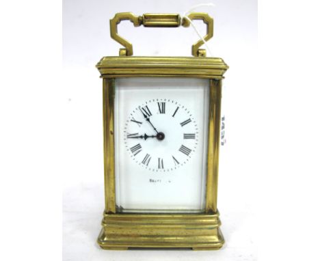 An Early XX Century French Brass Cased Carriage Clock, the white enamel dial with Roman numerals, the back plate inscribed 'M