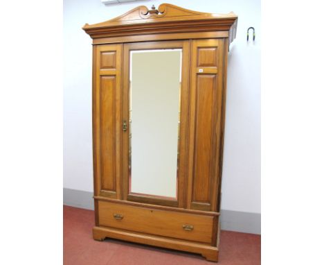 An Early XX Century Walnut Wardrobe, with swan neck pediment, central mirrored door, reeded sides and lower drawer on bracket