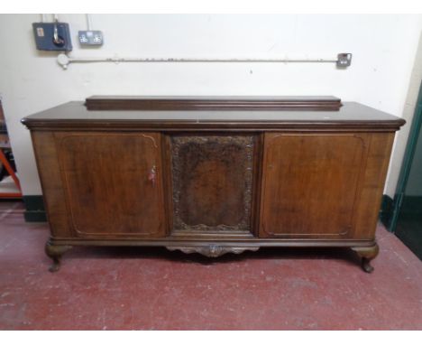An early 20th century continental sideboard with walnut panel inset 