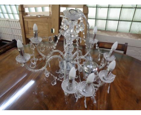 A decorative eight branch light fitting 