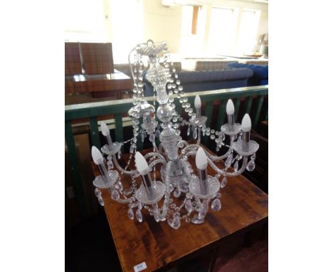 A decorative eight branch light fitting 