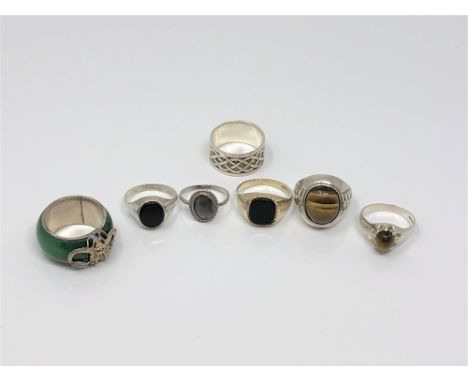 Five silver stone set rings, a Celtic knot silver band ring and an eastern white metal and hard stone ring (7)