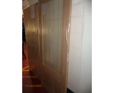 A light oak hardwood interior glazed door (new)