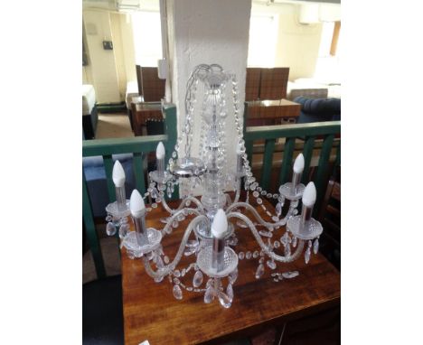 A decorative eight branch light fitting 