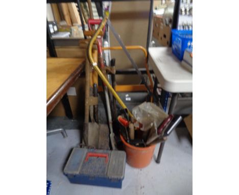 A garden roller, garden tools, spades, forks etc 