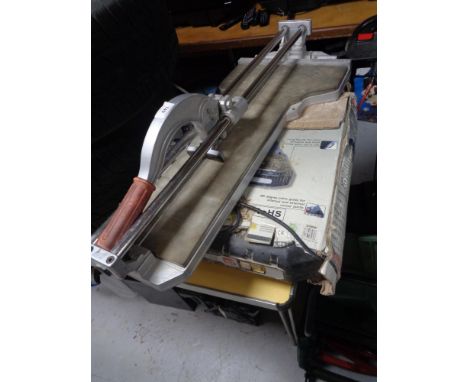 A wet tile saw and a further tile cutter 
