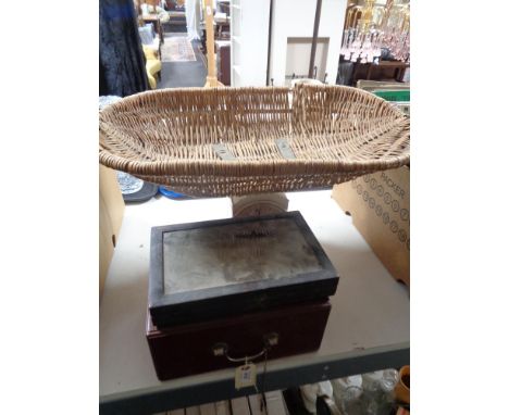 A set of family scales, an old wooden box and a display case 
