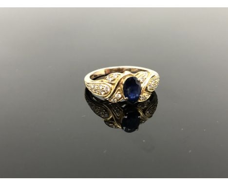 A gold sapphire and diamond ring, size N CONDITION REPORT: Unmarked. Believed to be 18ct gold. 