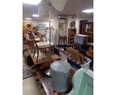 A galvanized storage bin and a floor lamp 