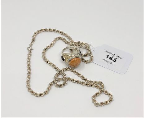 A silver rope-twist necklace, length 72cm, and a white metal dress ring