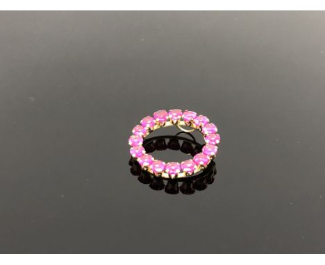 A 10ct gold ruby set pendant