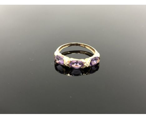 A 10ct gold diamond and amethyst ring, size M