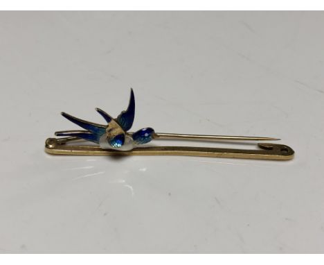 A 15ct gold bar brooch with pearl and enamelled decoration modelled as a bird in flight 