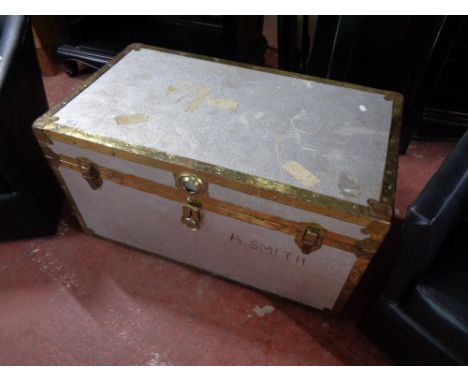 A metal bound shipping trunk