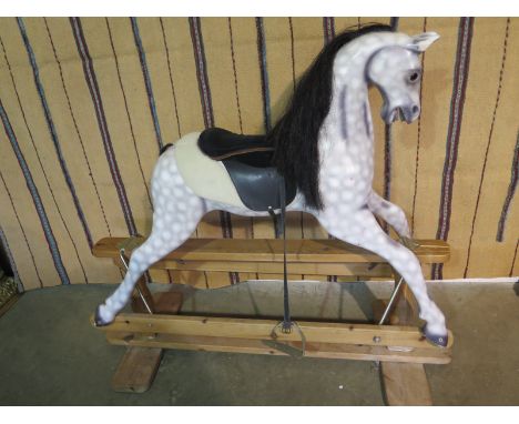 A dapple grey rocking horse - 114cm high 