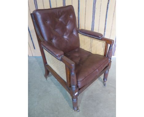 A Regency mahogany bergere library armchair, with button leather seat pads - 95cm H x 67cm D x 67cm W 