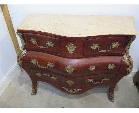 A Louis XV style bombe shaped commode with marquetry inlays, four drawers, marble top, gilt mountings approx 115cm W x 50cm D