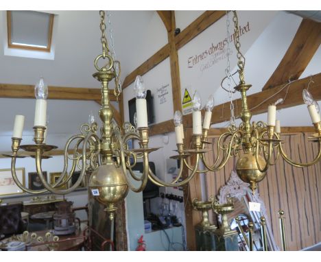 A pair of Dutch style brass eight-light chandeliers - 62cm tall, 75cm wide 