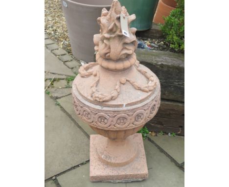 A terracotta urn shaped finial - 94cm tall 