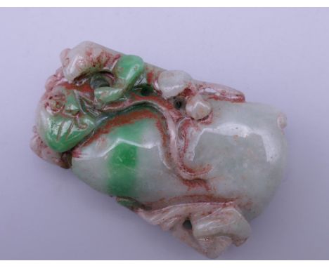 A carved jade pendant. 5.5 cm high.