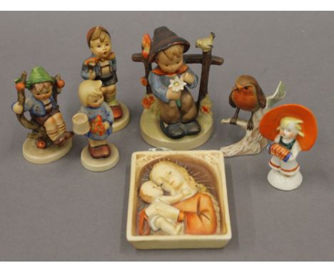 A collection of Hummel and Goebel porcelain figures