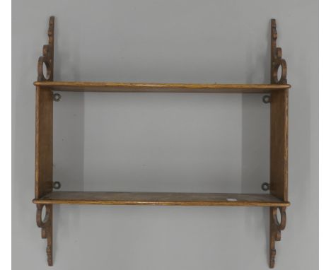 A Victorian oak hanging shelf. 46 cm wide.
