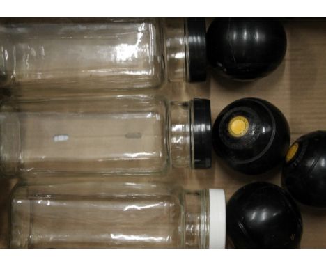 Three vintage sweet jars and four ebonised bowling balls. 