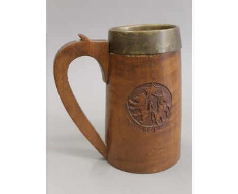 A treen carved tankard. 18 cm high.