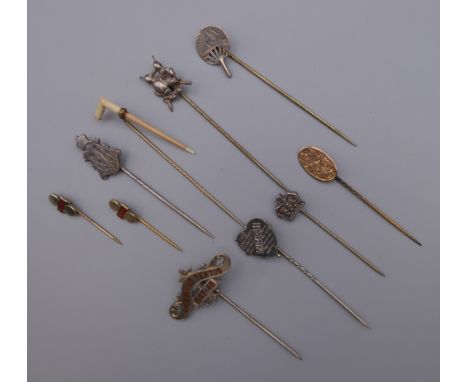 Ten vintage stick pins, including silver. The largest 8 cm long.