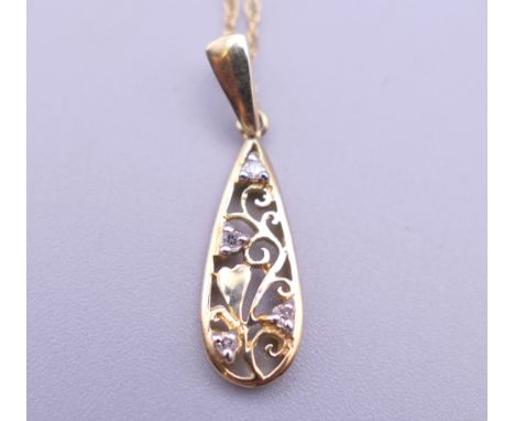 A 9 ct gold and diamond Brook &amp; Bentley 'Garland of Love' teardrop pendant on a fine rope chain. The pendant 2.5 cm high.