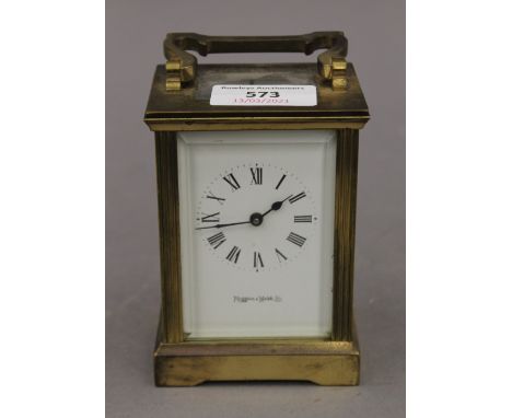 A Mappin and Webb carriage clock.  11 cm high excluding handle.